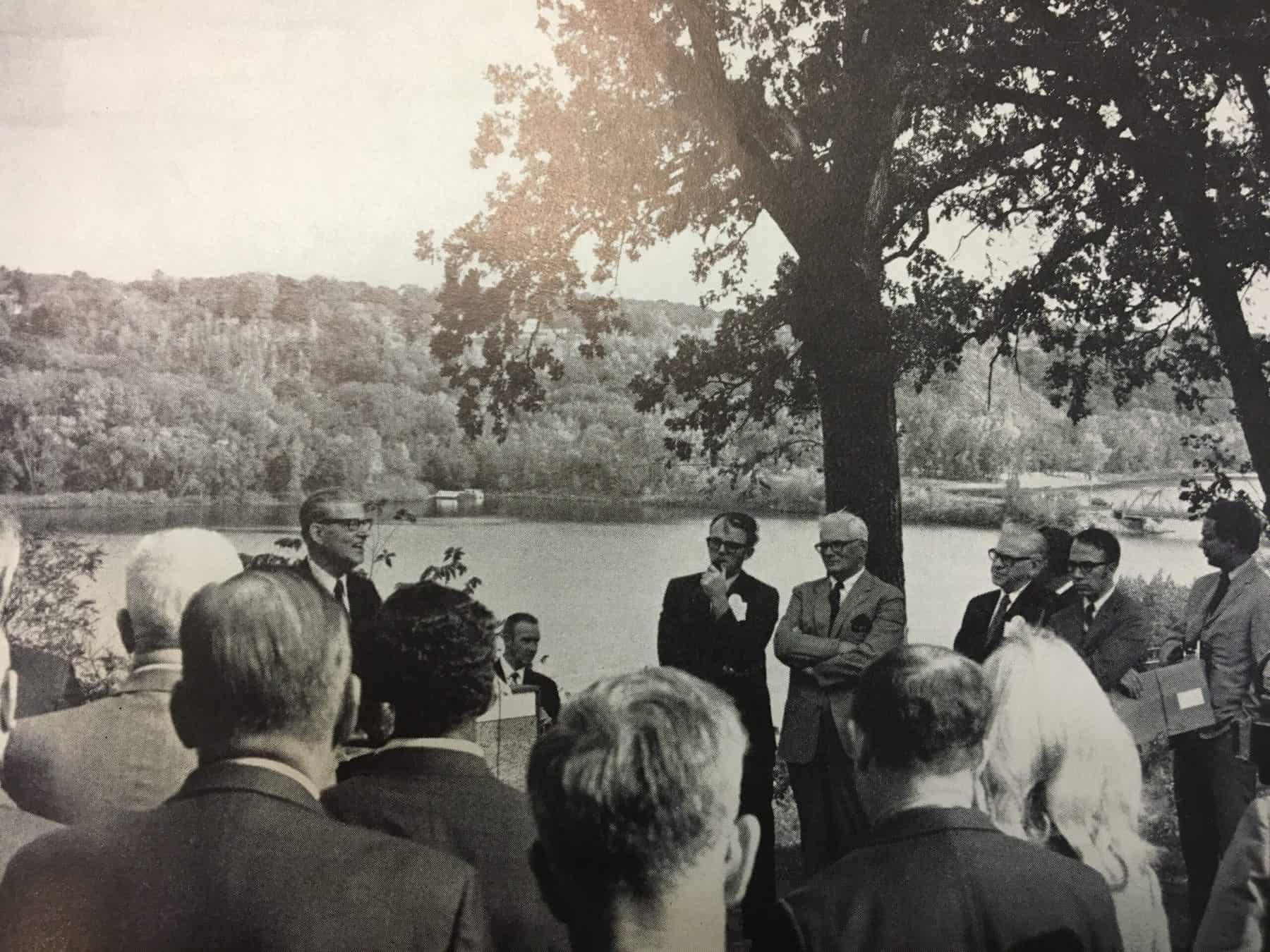 Black and white photo of a crowd near the St. Croix listening to speeches.