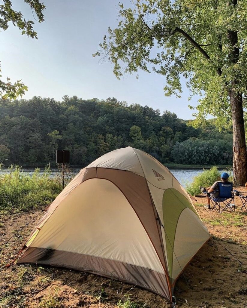 A camping tent set up on the sandy bank of the St. Croix River. Photo by Kate Wright.