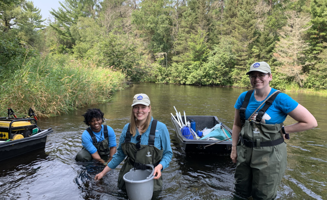3 Wild Rivers Conservancy Summer Interns Stand in the Namekagon River, while conducting trout population surveys with the WI DNR